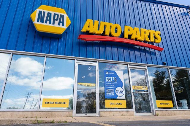 NAPA Auto Parts Store exterior in blue with glass doors and windows.