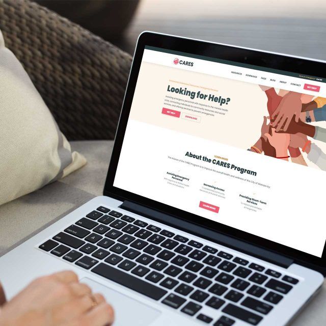 Laptop showing a website with Looking for Help? on the screen.