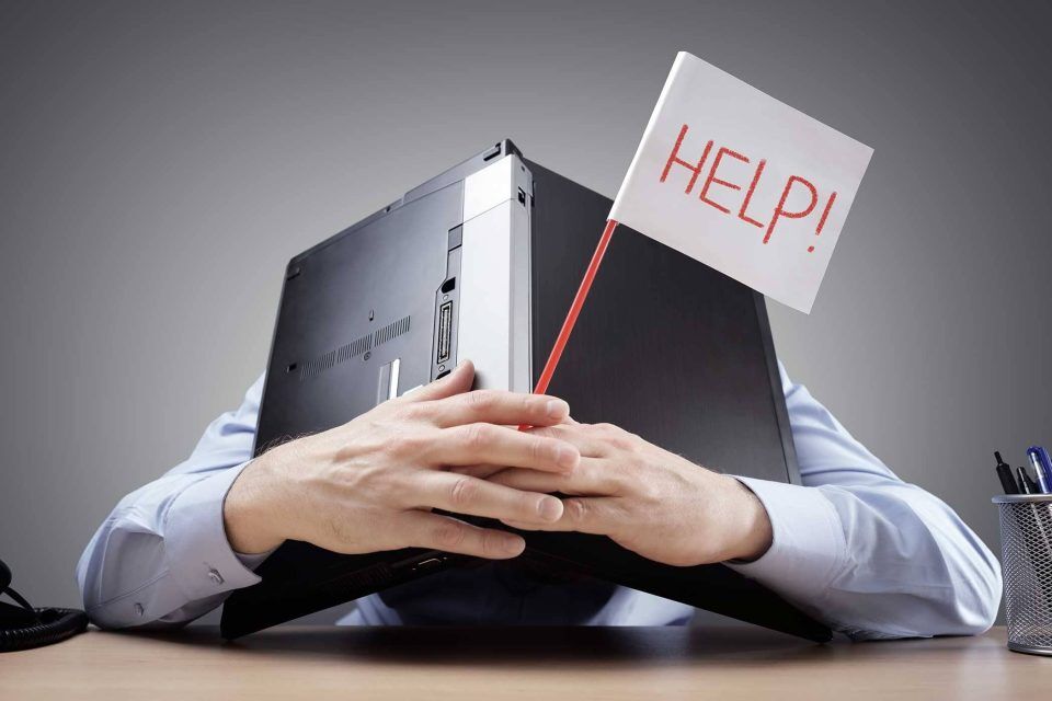 Person waving HELP! flag with laptop amid domain scam threat.