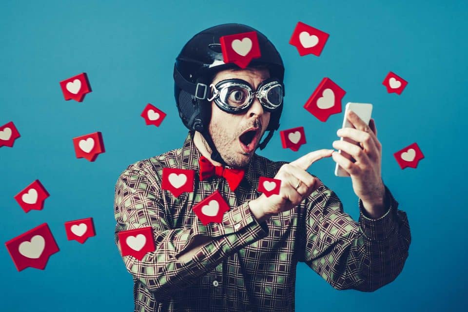 Man in helmet on phone, discovering Instagram for Business success.