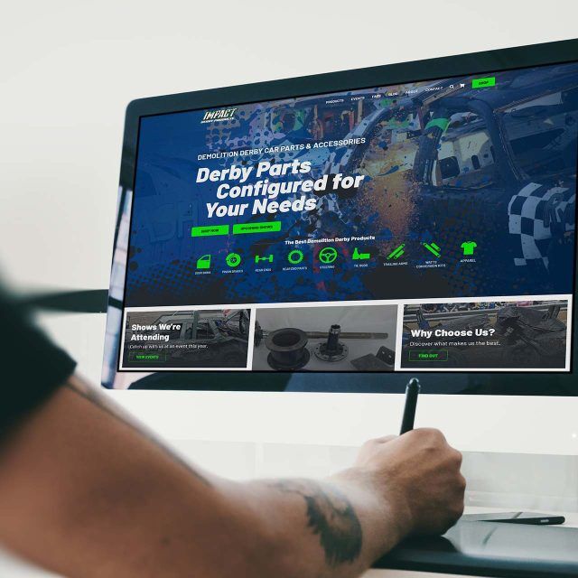 A person uses a stylus on a desktop to explore Impact Derby Products online.