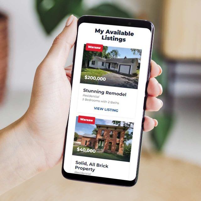 Hand showing Jeff Owens listings and property images on phone.