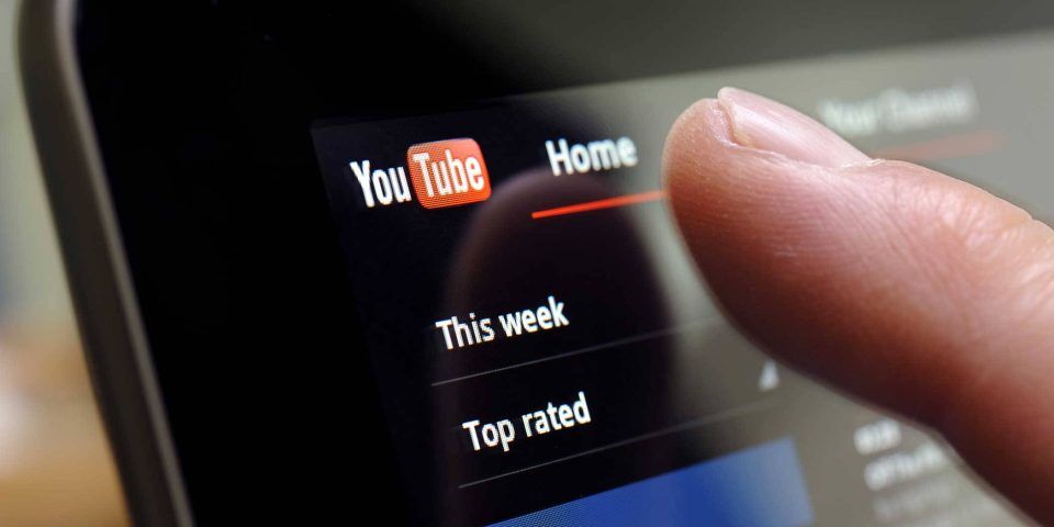 Tapping on the YouTube homepage of this social media platform.