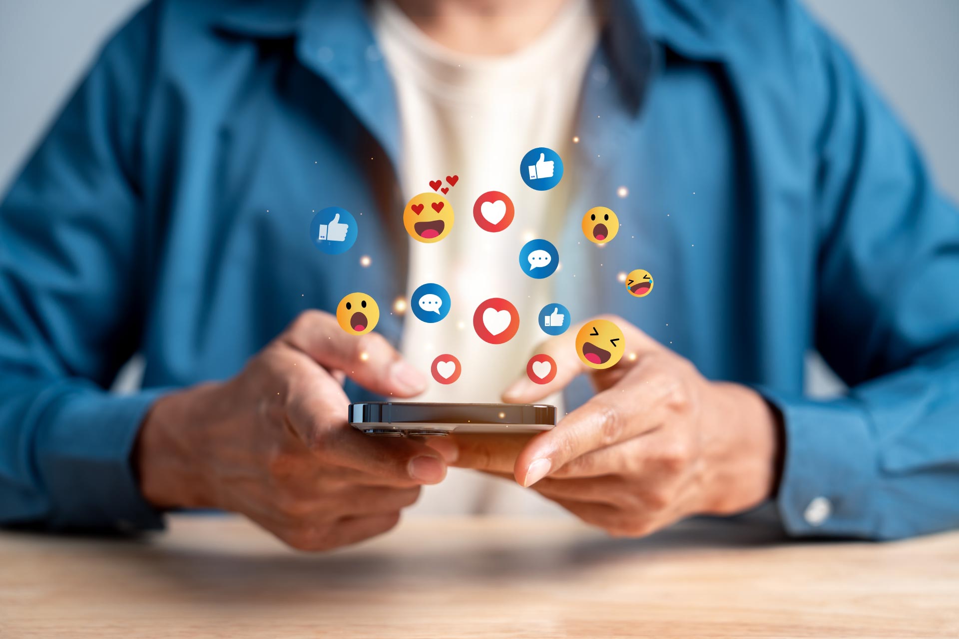 Person using a smartphone with floating voice search optimization icons above it.
