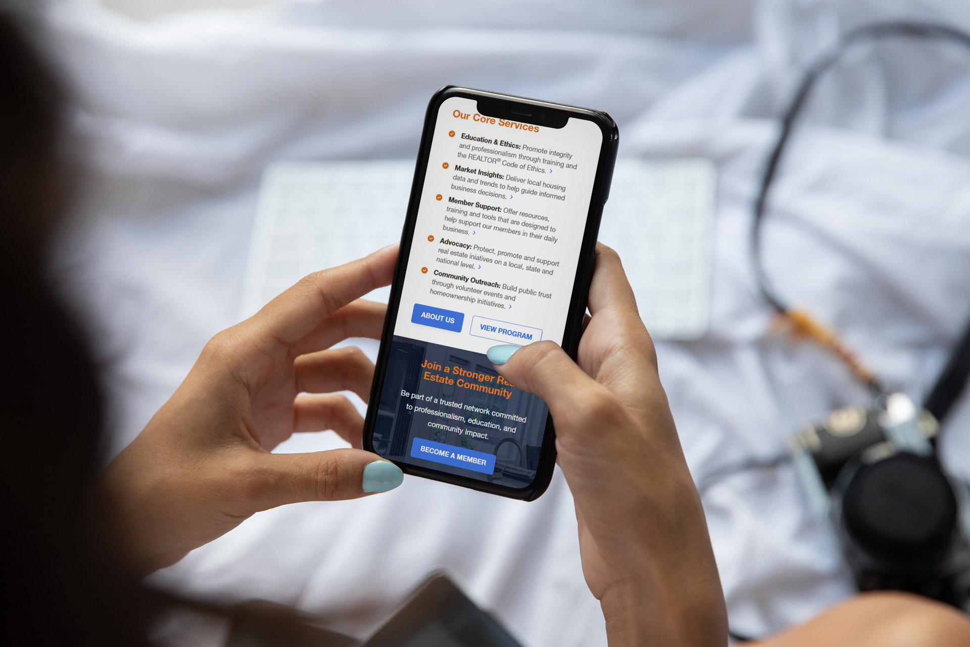 Person holding a smartphone and browsing a charity organizations website.