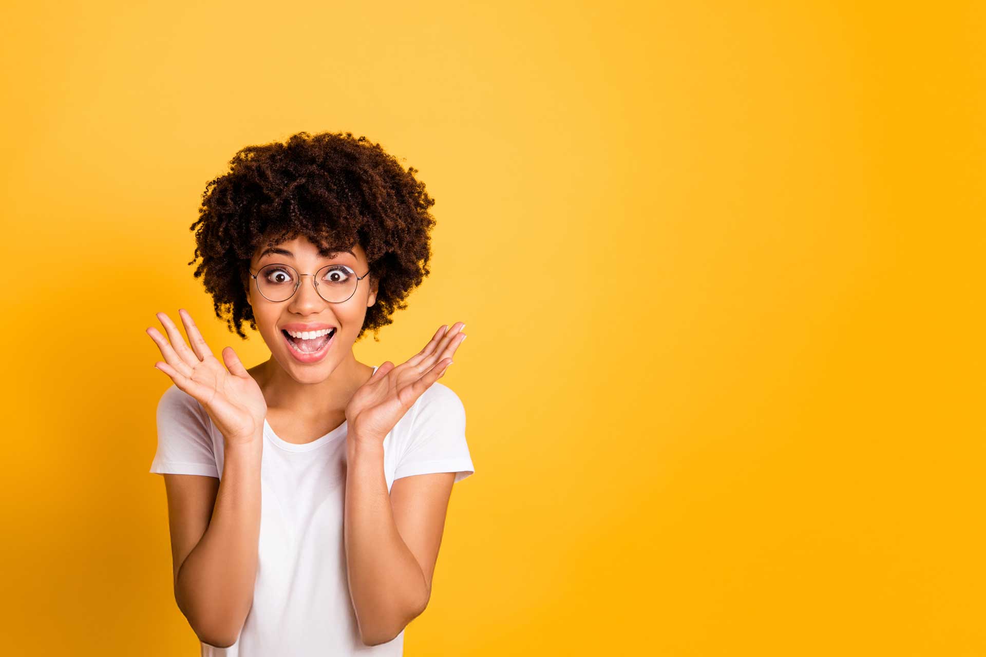 Person in white shirt, shocked, amid a bright yellow background of traditional marketing.