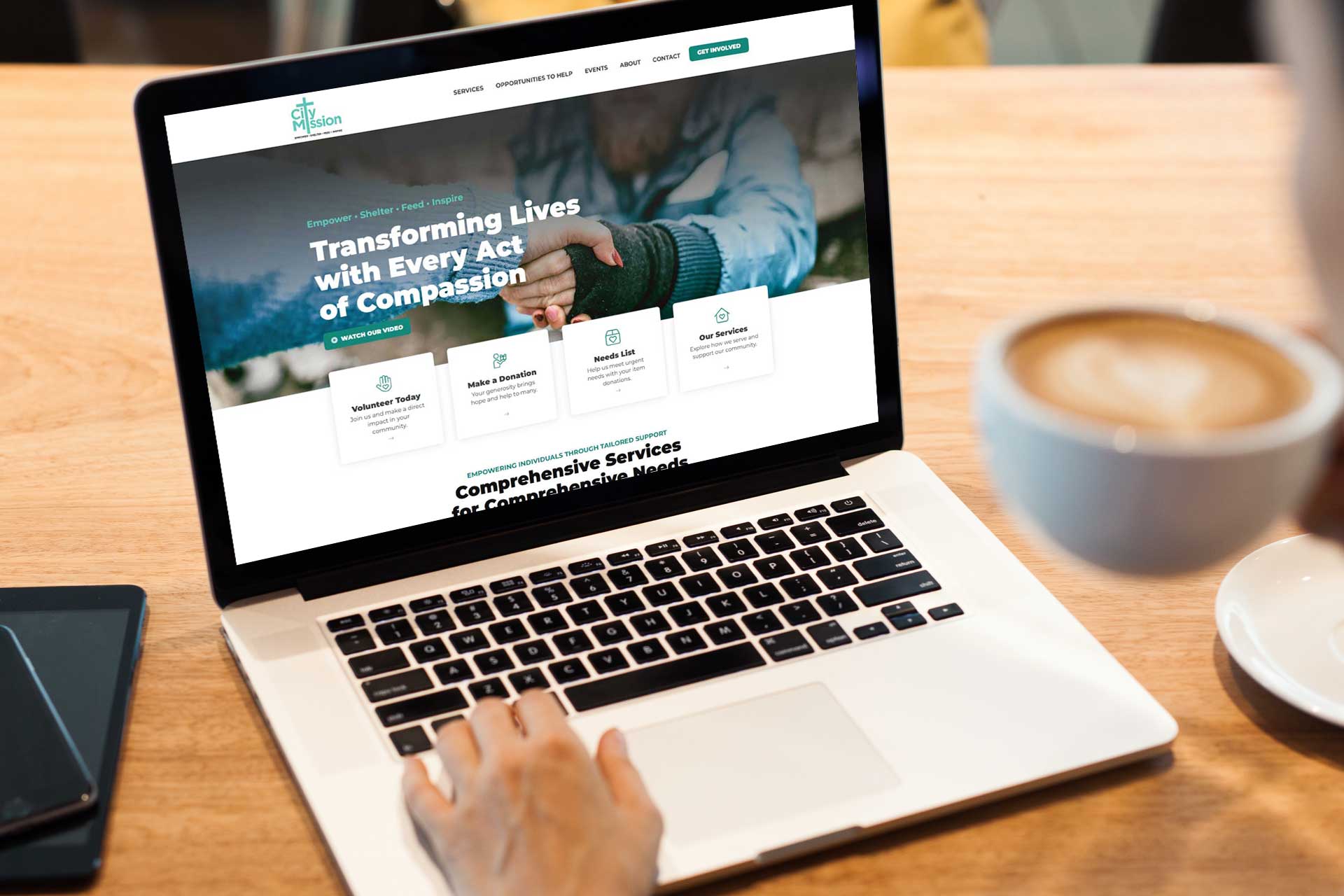 Person on a laptop exploring the City Mission of Findlays compassion services.