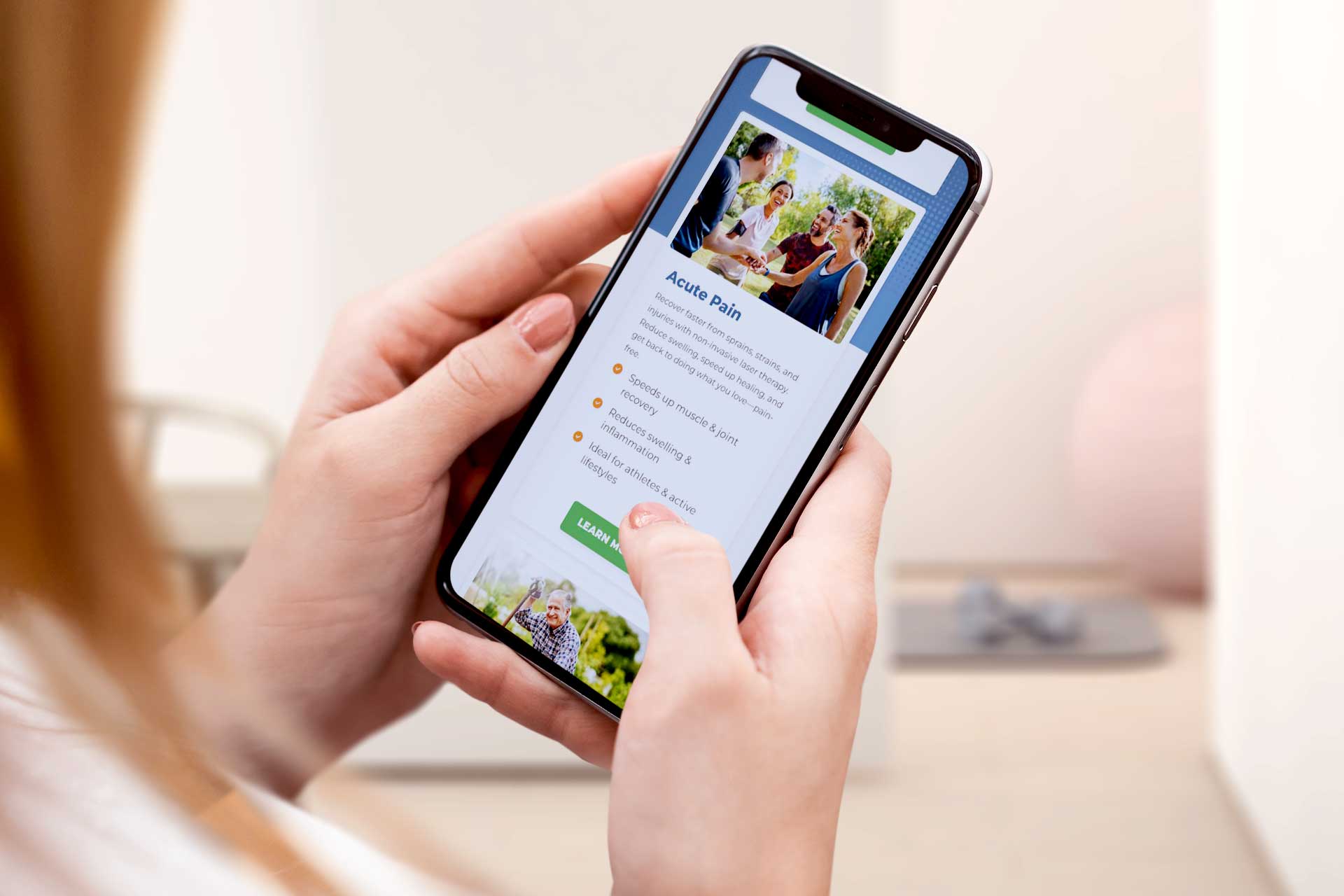 Lake City Restoration webpage displayed on a smartphone about acute pain.