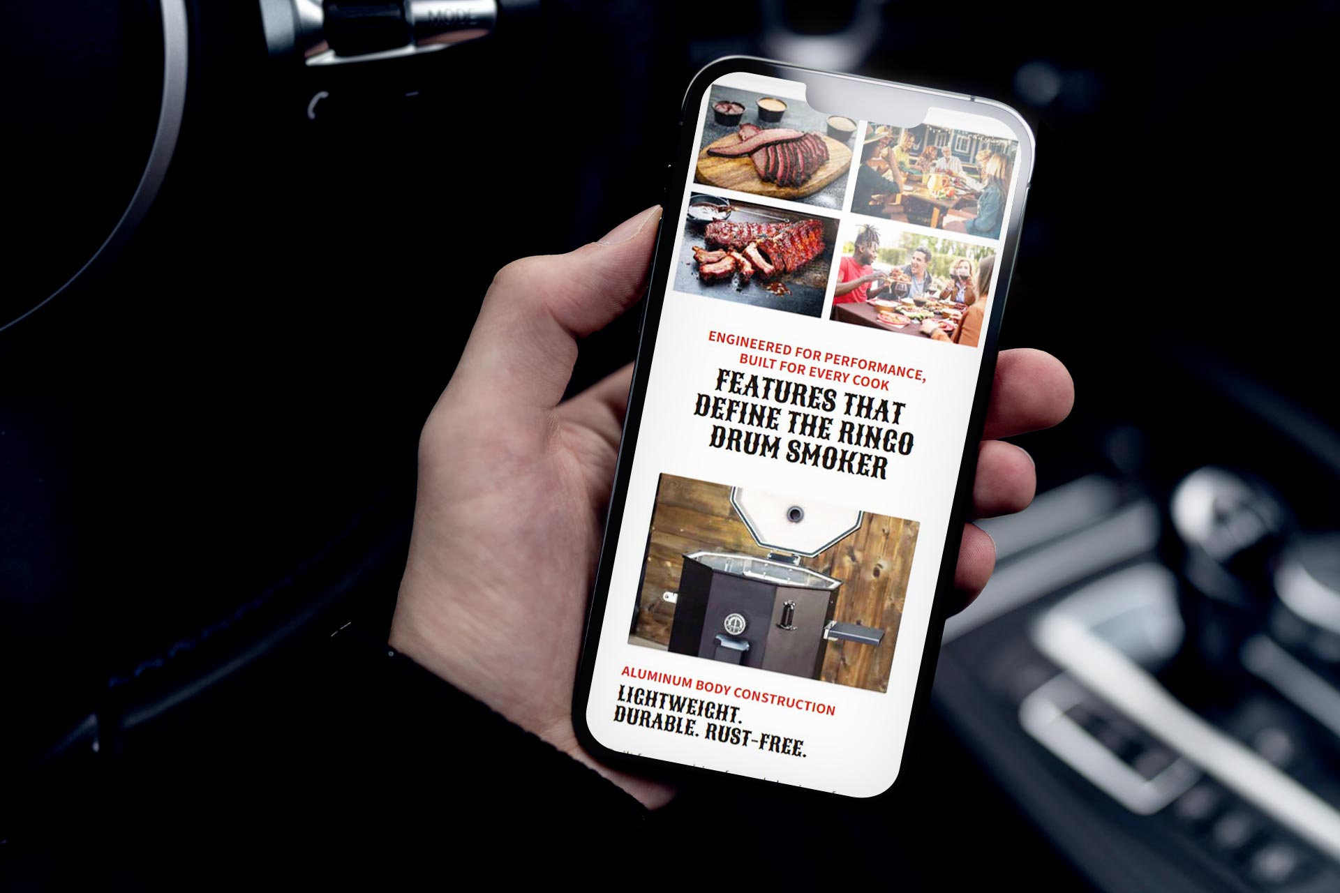 Person holding a phone displaying a barbecue smoker advertisement with food images.