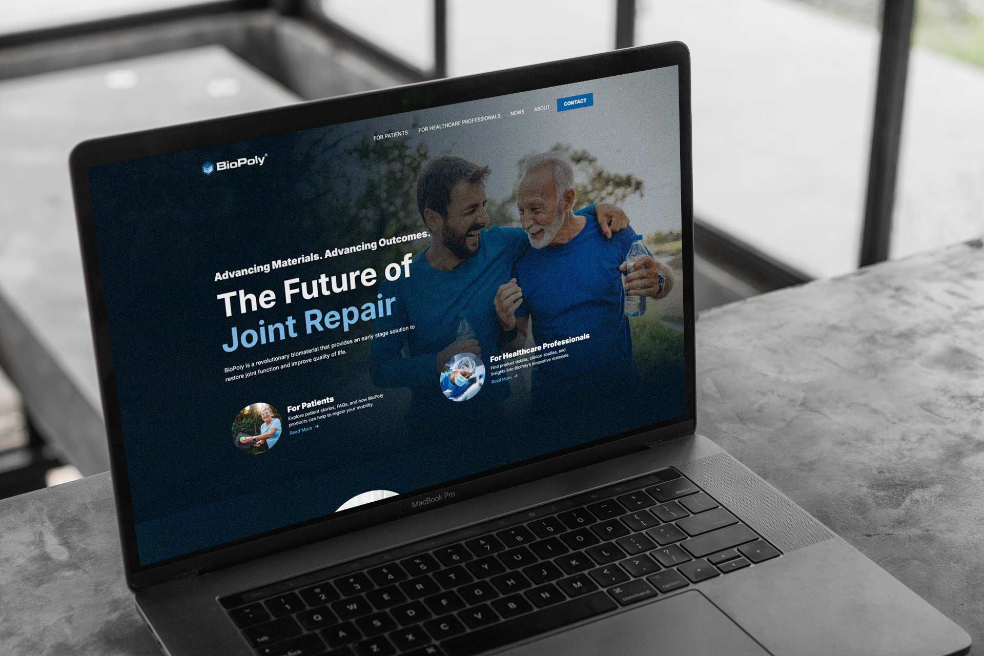 Laptop displaying BioPoly joint repair webpage with two smiling people.