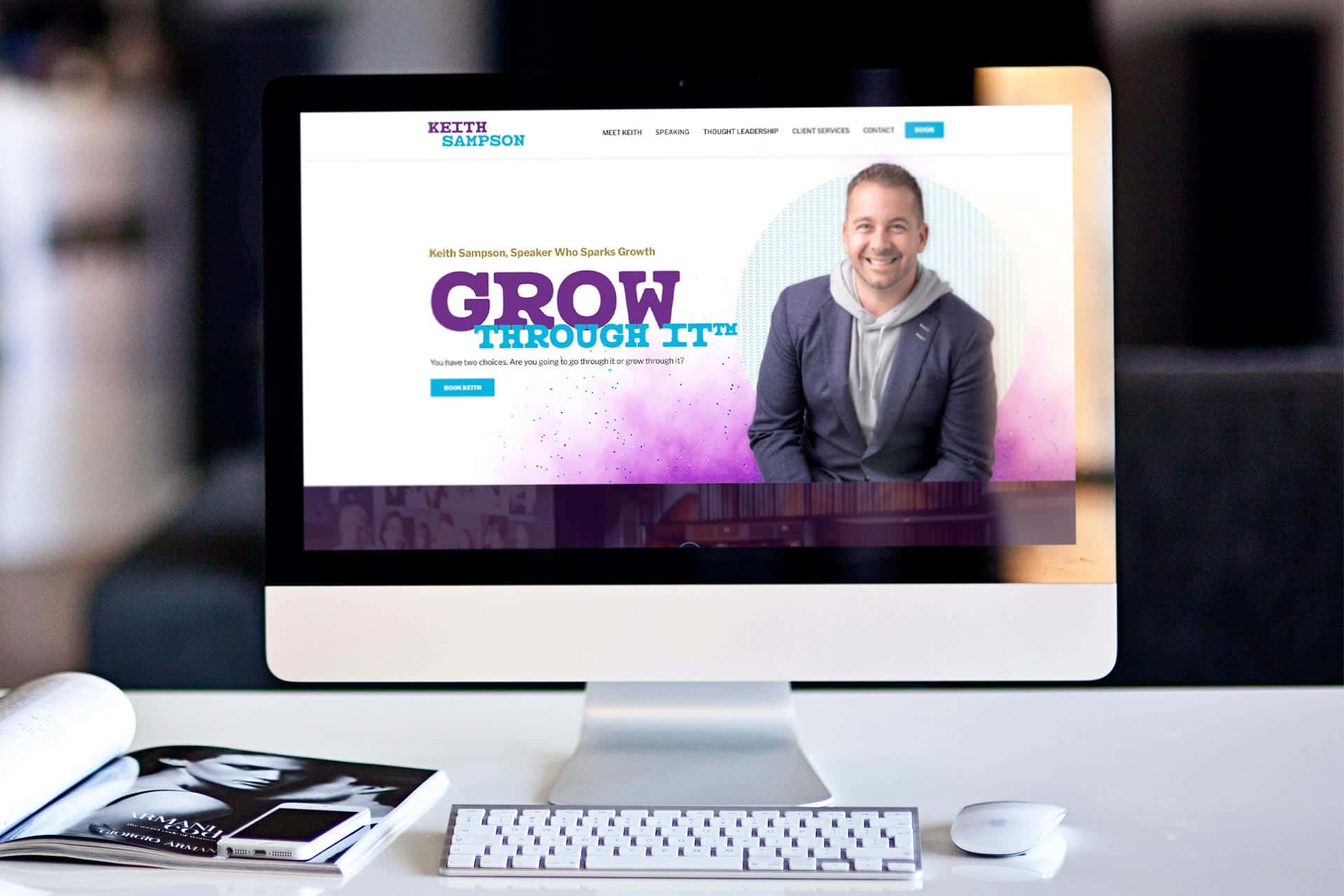 A desktop computer displays a website for a motivational speaker named Keith Sampson.