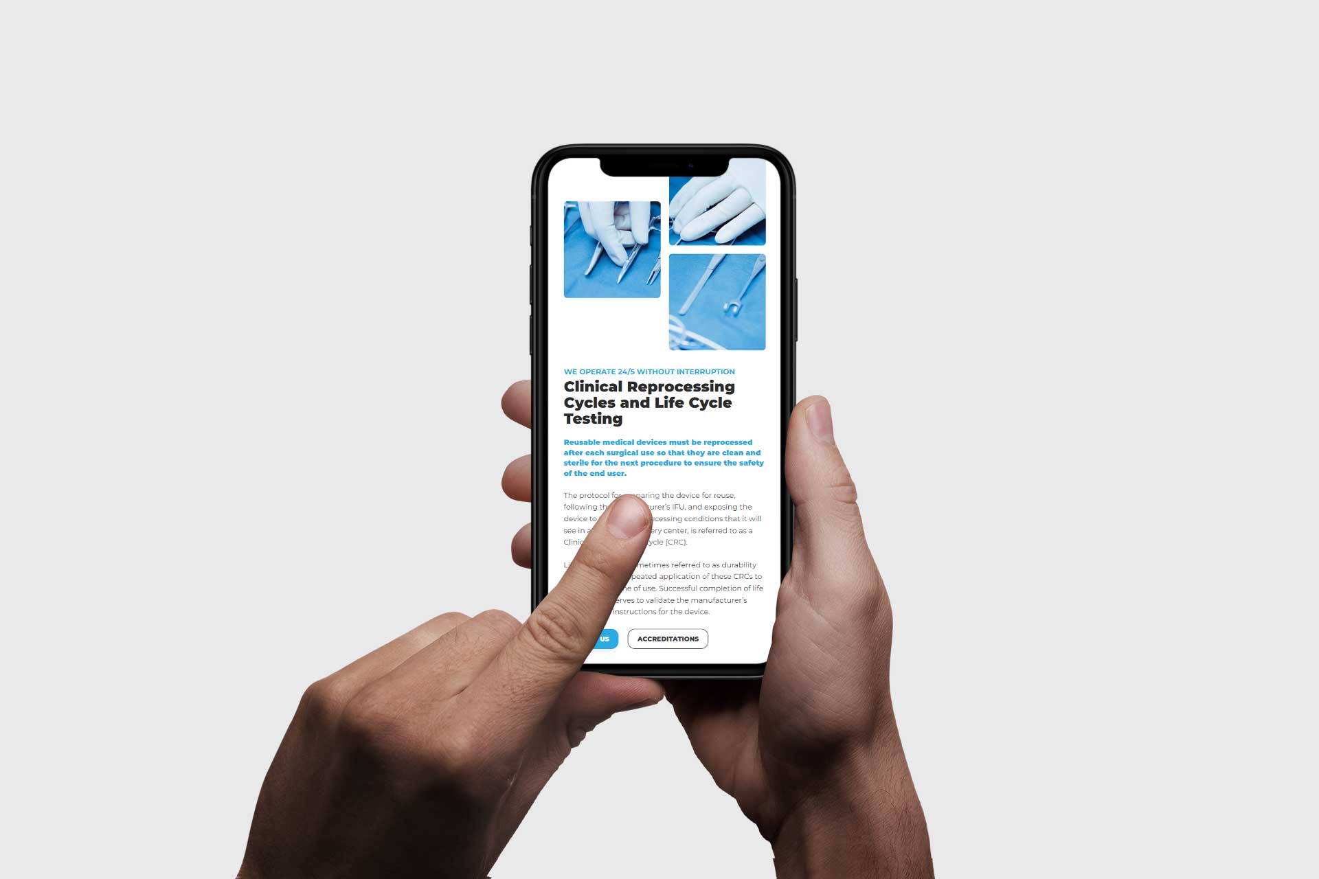 Hands holding a smartphone displaying a SteriLogix medical article with images.