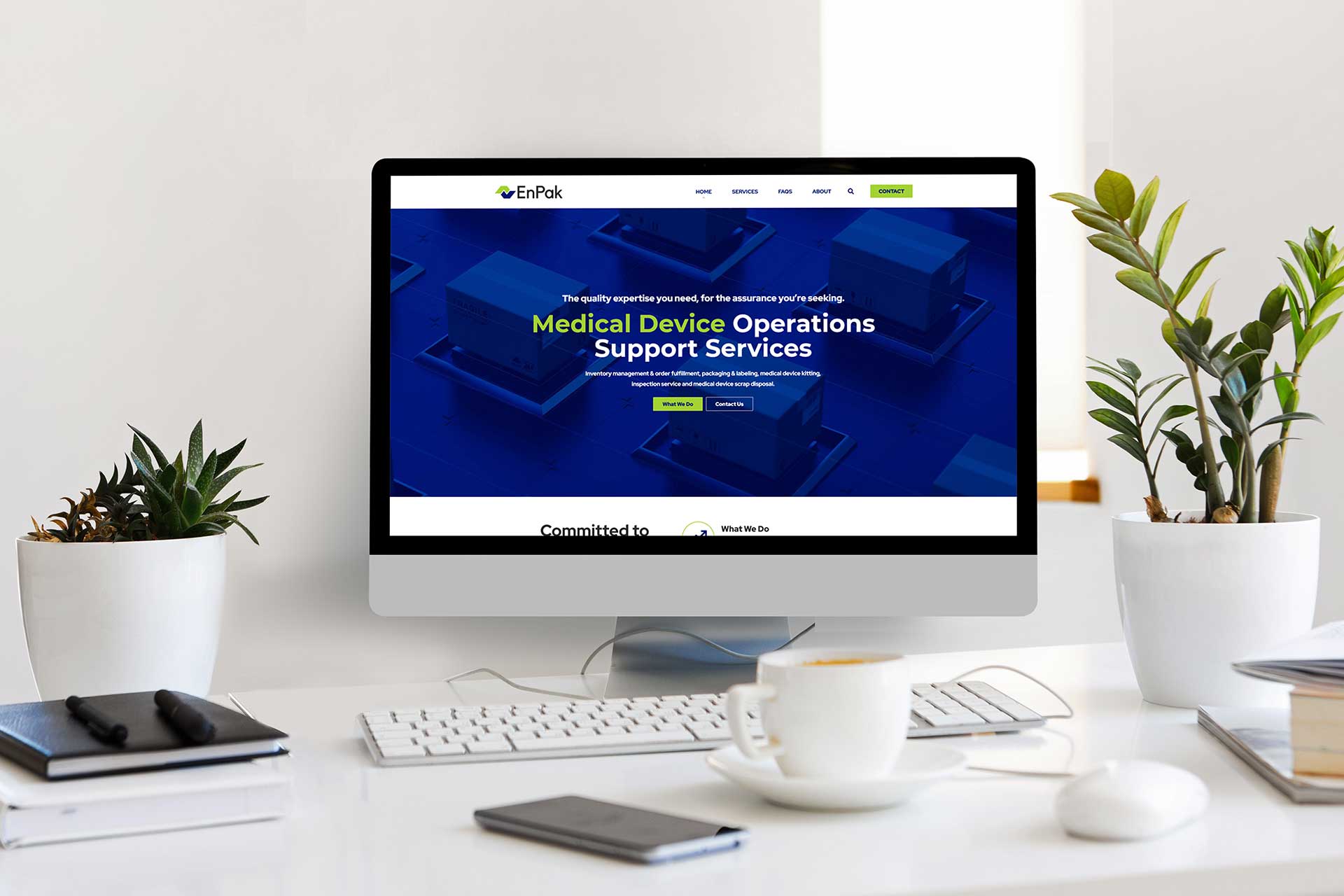 Computer on desk showing EnPak medical device operations website.