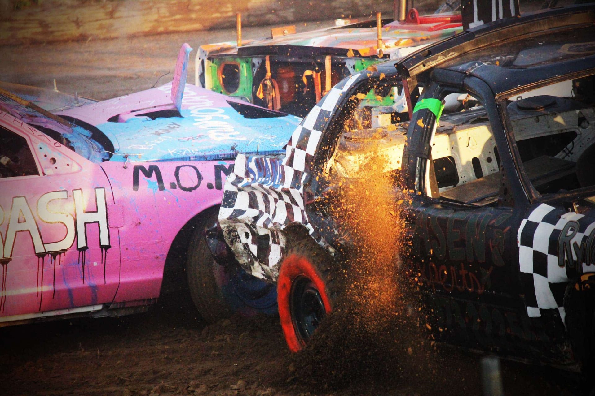 Impact Derby Products colliding, kicking up dirt and debris.