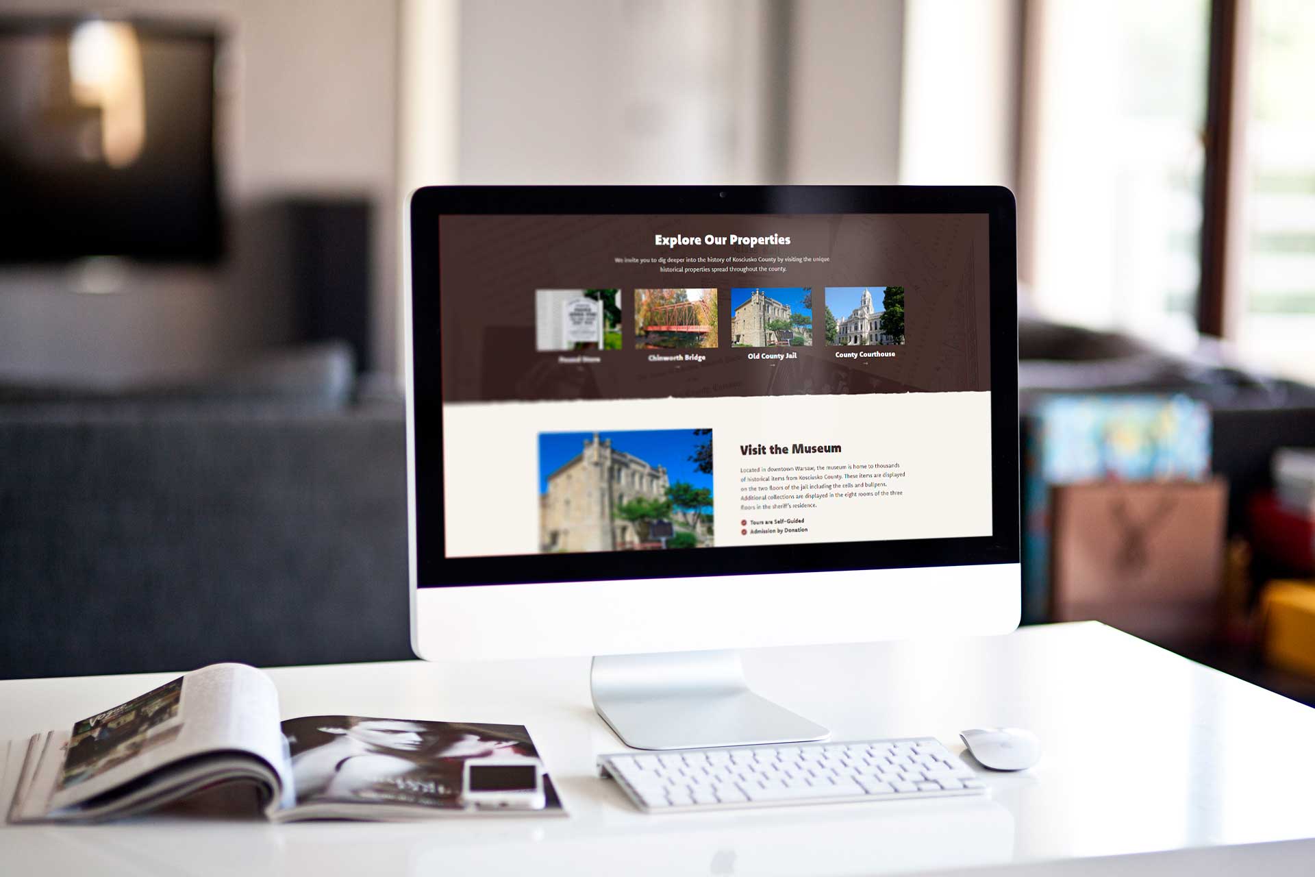 Computer displays Kosciusko County Historical Society site on a desk.