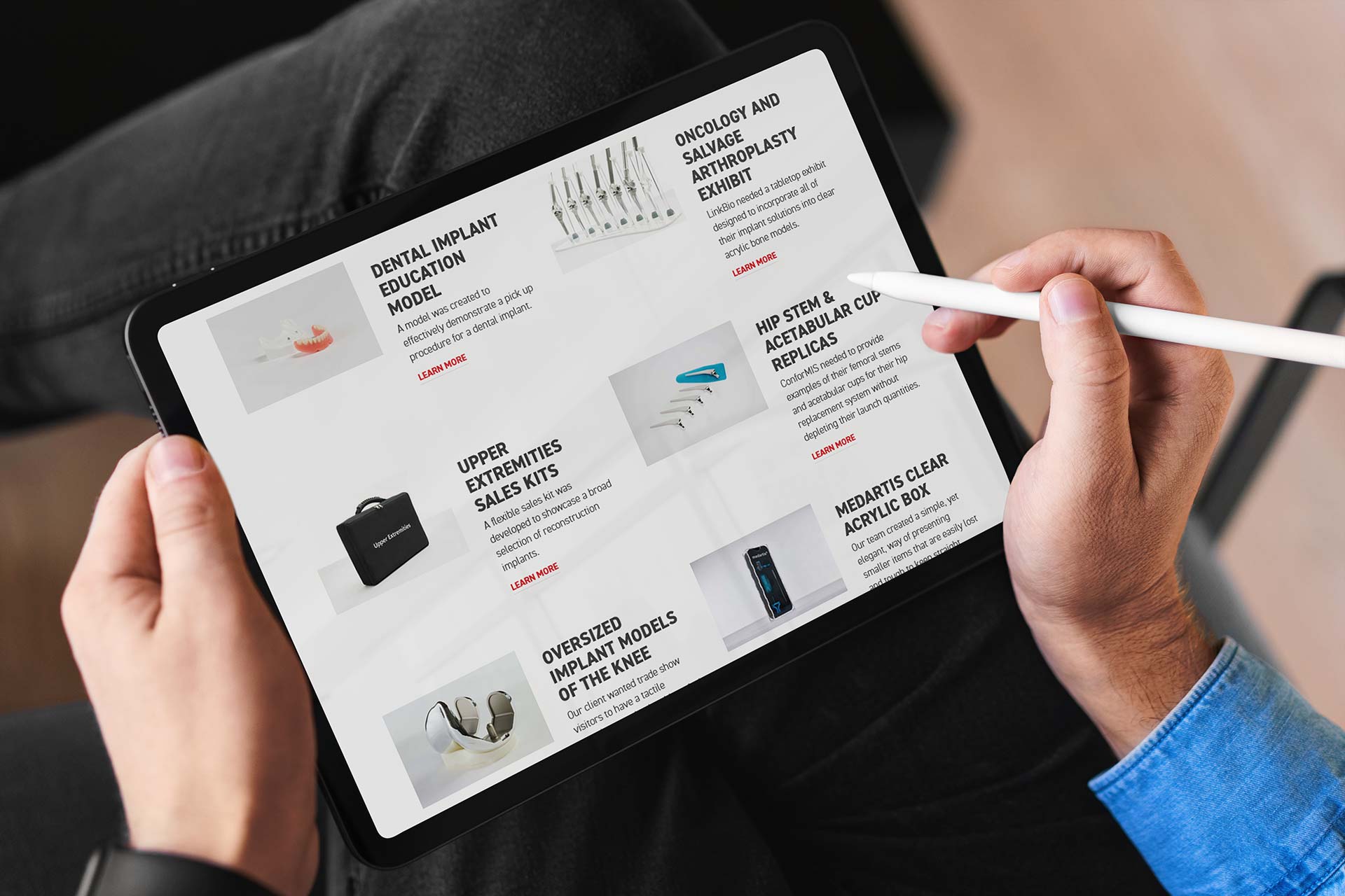 Person using stylus on a tablet displaying OsteoShape products list.