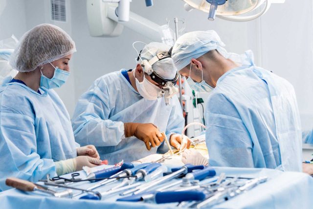 SteriLogix team conducts an operation in a sterile operating room.