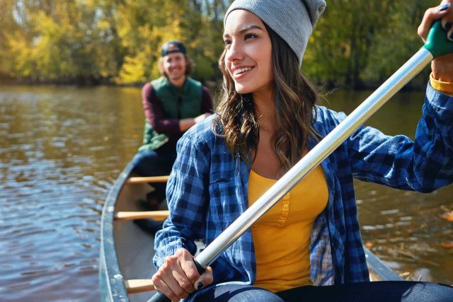 Two on a canoe, embracing the calm of Tippy River adventures.