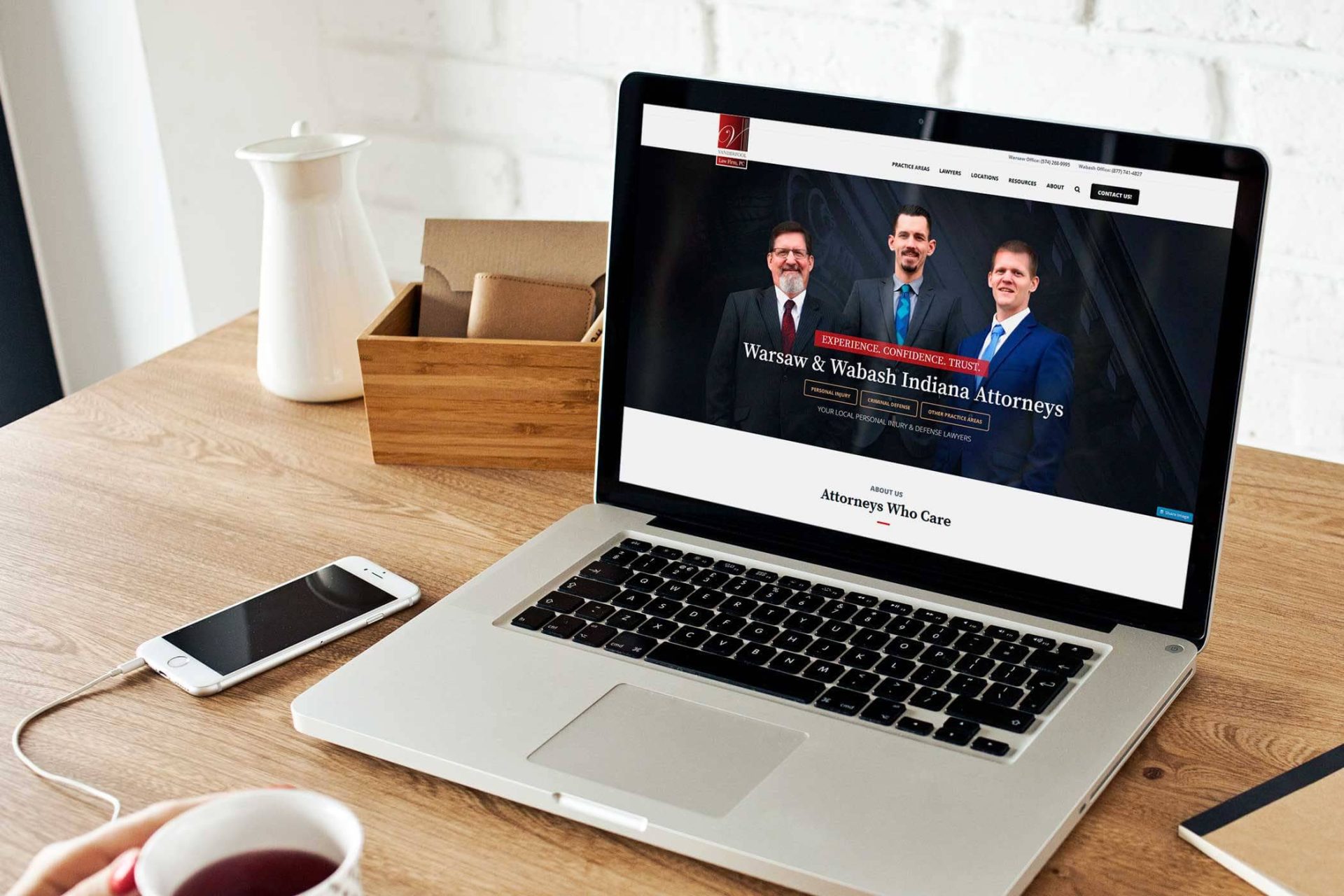 Vanderpool Law Firm website displayed on a laptop on a desk.